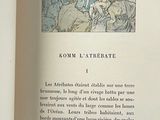 an open book with a picture of a group of people on it