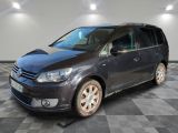 the grey van is parked in a room with a checkered floor
