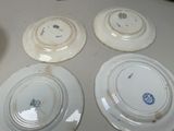 four plates that are sitting on a table