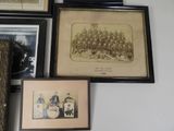 many framed pictures of a group of people on the wall