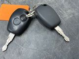 a car key and a remote control on a table