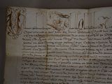 an old book with writing on it sitting on a table