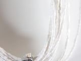 a close up of a necklace on a mannequin mannequin
