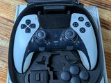 a black and white video game controller in a box