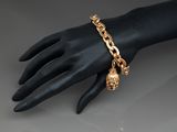 a close up of a person ' s hand with a bracelet on it