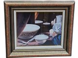 tableau encadré représentant une table avec des bols et des cuillères