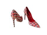 red and black patterned high heels on a white background