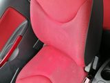 a red seat in the back of a car
