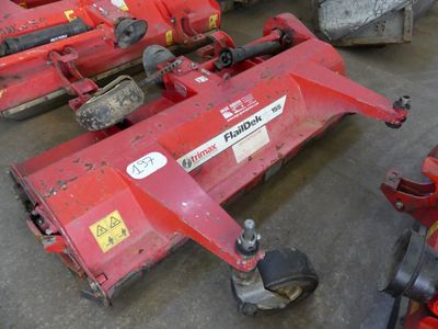 many different types of lawn mowers on the ground