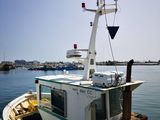 a small boat that is docked in the water