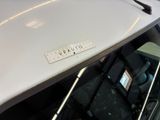 a white car with a scrabble sticker on it