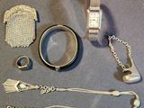 a lot of silver items that are on the table