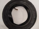 two tires on the wall next to each other
