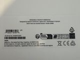 the back of a white box with a black and white sticker on it