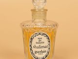 an image of a small bottle of perfume on a table