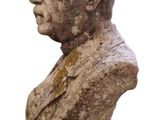 statue of a bust of a man in a suit on a white background