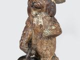 figurine représentant un chien coiffé d'un sombrero et tenant un bol