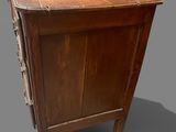 a wooden cabinet with drawers and a drawer underneath it