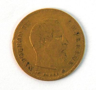 l'image d'une pièce d'or sur laquelle figure le visage d'un homme