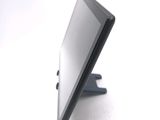 a tablet computer sitting on a stand on a white surface
