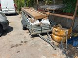 a truck with a trailer attached to it with a lot of wood