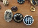 a lot of buttons on a table that are on the table