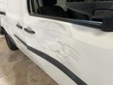 a white van with a black stripe on the side of it
