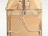 a small wooden box with a rope hanging from it ' s side