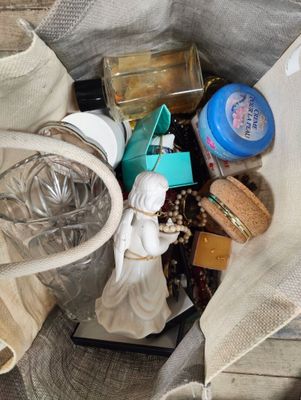 a tote bag full of items that are sitting on the floor
