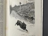 an open book with a picture of a dog running in the dirt