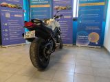 a motorcycle that is parked in a showroom