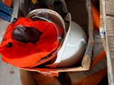 a cardboard box with a helmet and other items in it