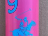 a pink bottle with a blue lid sitting on a tile floor