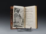 an open book with a picture of a man and a dog on it