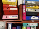 a lot of binders that are in a drawer