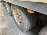 a close up of a flat tire on a truck
