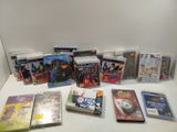 a lot of dvds on a white table next to each other