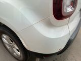 a white car parked on the side of the street