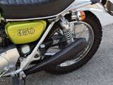 a motorcycle that is parked on the side of the street