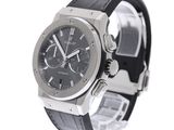 a watch that is on a black leather strap