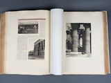an open book with a picture of a building in it