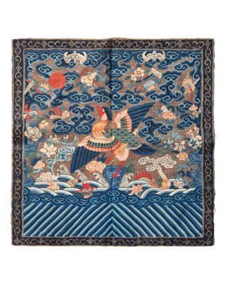 a close up of a tapestry with a bird on it ' s back