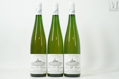 three bottles of wine sitting next to each other on a table