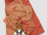 an image of a scarf with a medal on top of it