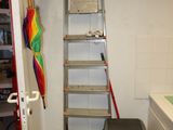 a ladder that is leaning against a wall in a room
