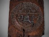 an image of a plaque on a white surface