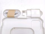 a white tray with a charger and a cord attached to it