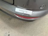 a picture of a car that has a sticker on it