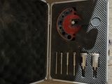 a metal case with tools in it sitting on a table