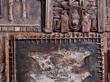 several pieces of art are displayed on the wall of a building
